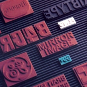 Modular stamp system - Ribtype stamps allow moving type to create multiple stamps from one or more letter or number sets.